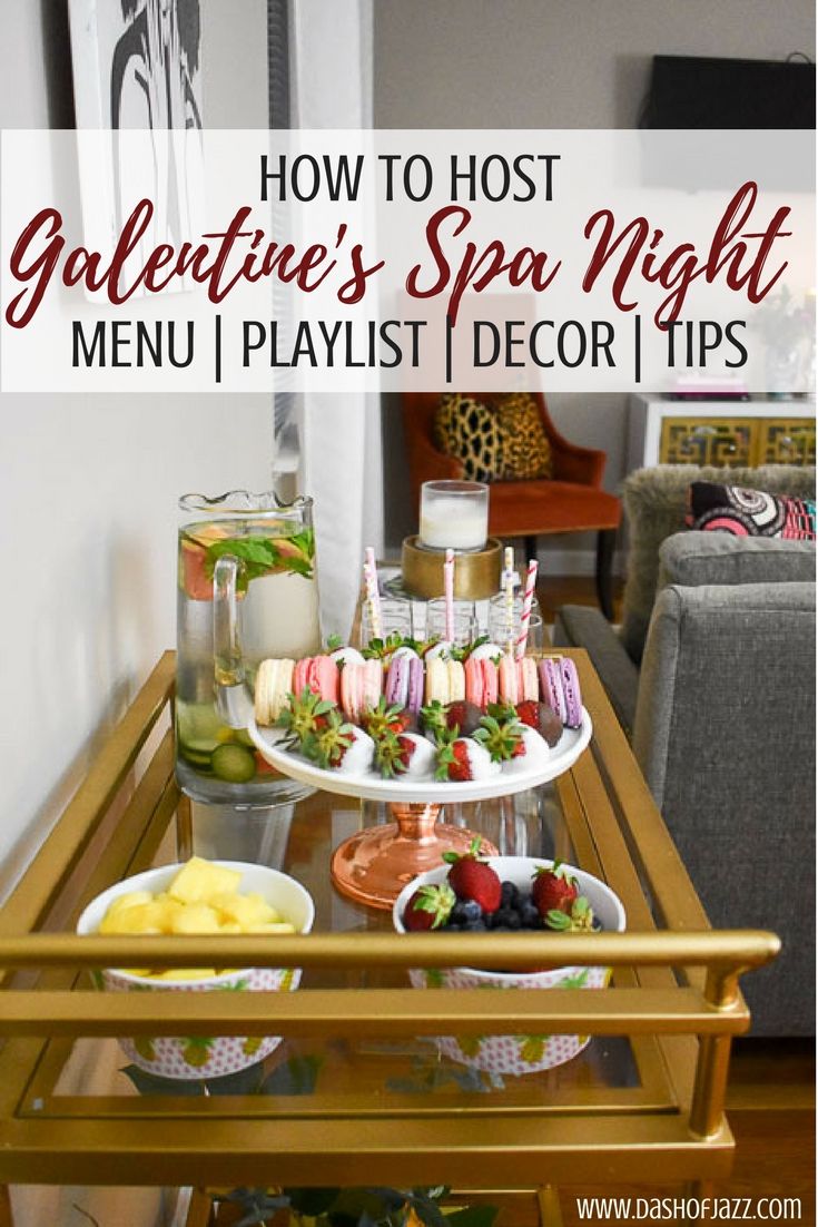 a table filled with food and drinks on top of a wooden table next to a couch