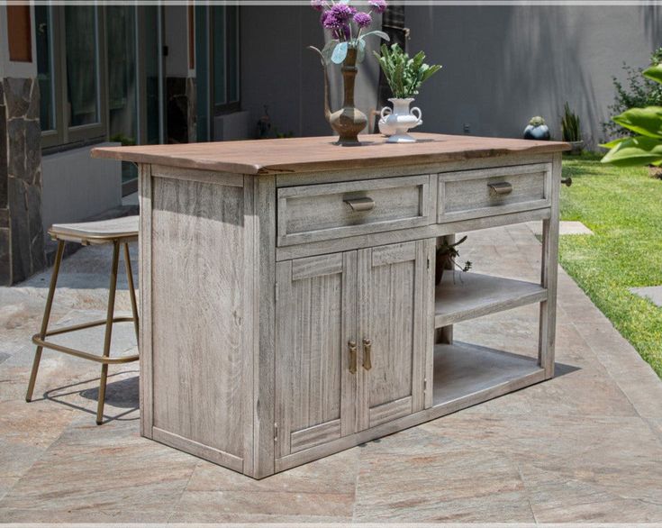 a kitchen island made out of an old wooden table