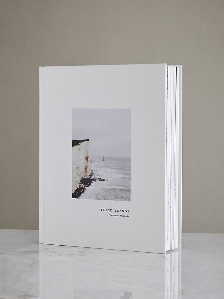 a white book with an image of the ocean on it