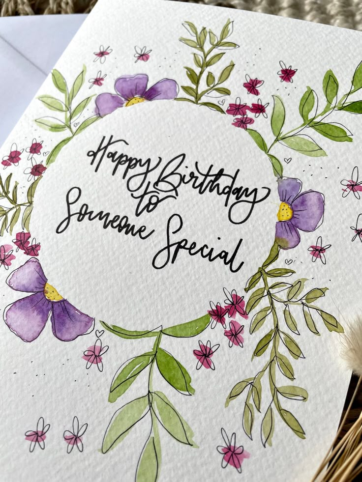 a birthday card with watercolor flowers and the words happy birthday to someone special on it