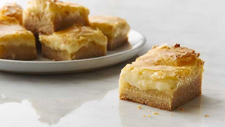 a white plate topped with pieces of cake