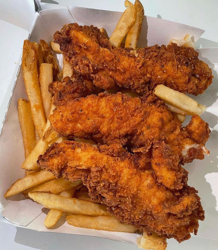 fried chicken and french fries in a box