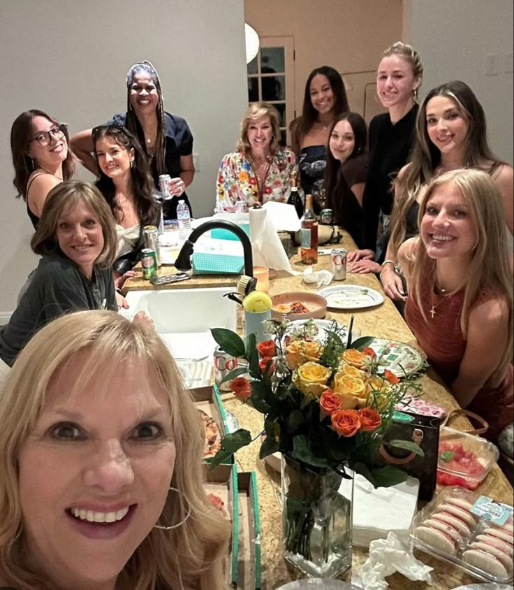 a group of women sitting around a table