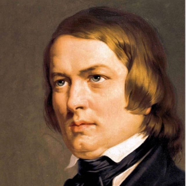 a portrait of a man with long hair