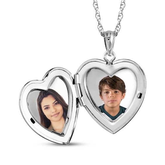 This petite locket lovingly keeps two photos close to your heart. Crafted in sterling silver Polished to a bright shine, the 20mm heart-shaped locket opens to reveal two photos The 18-inch rope chain secures with a spring ring clasp Please follow these steps: 1) Place your order; 2) Text your photo from your smartphone to (330) 435-8997; and 3) When prompted, please respond with your Order Confirmation #. Standard text messaging rates may apply. Sterling Silver Double Heart Locket For Mother's Day, White Gold Double Heart Locket Necklace In Sterling Silver, Personalized Double Heart Sterling Silver Locket Necklace, Mother's Day White Gold Locket Necklace Keepsake, White Gold Heart Pendant Locket For Keepsake, White Gold Heart Pendant Locket Necklace For Keepsake, White Gold Locket Necklace For Mother's Day Keepsake, Heart Pendant Locket Necklace In White Gold, White Gold Heart Pendant Locket Necklace