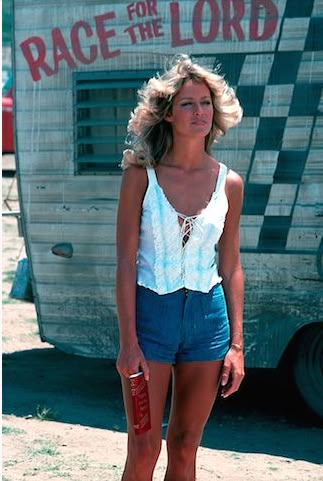 a woman standing in front of a trailer