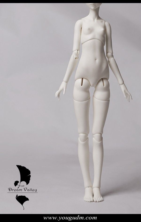 a white female mannequin is posed on a gray background