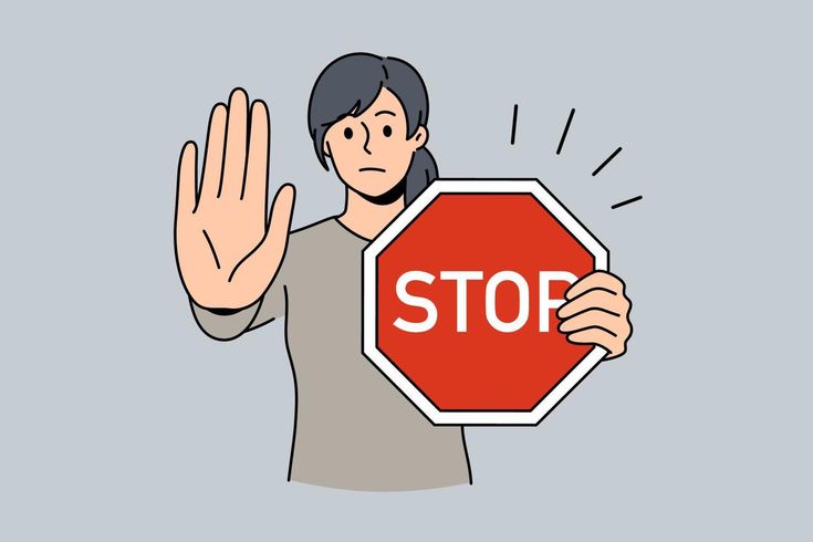 a man holding a stop sign with his hand in front of him and the word stop written on it