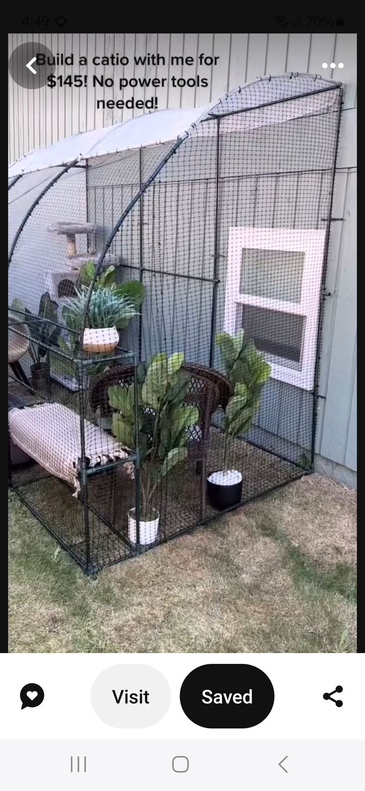 a small bird cage with plants in it