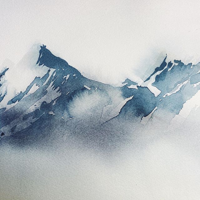 watercolor painting of mountains in the fog