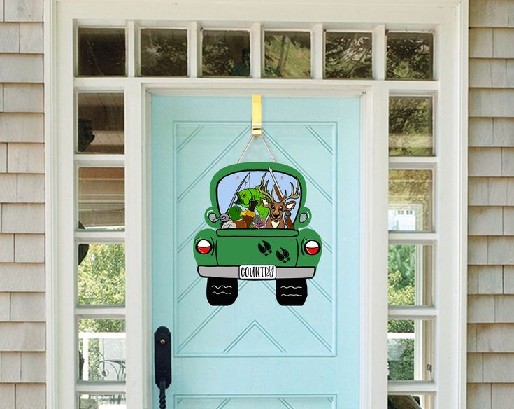 a door with a green car painted on it and the words'welcome home '