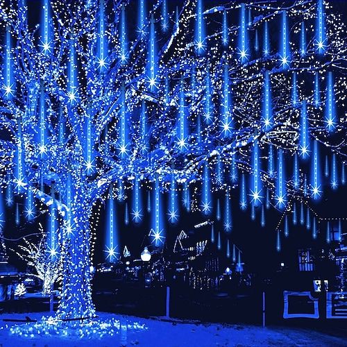 a tree that is lit up with blue lights