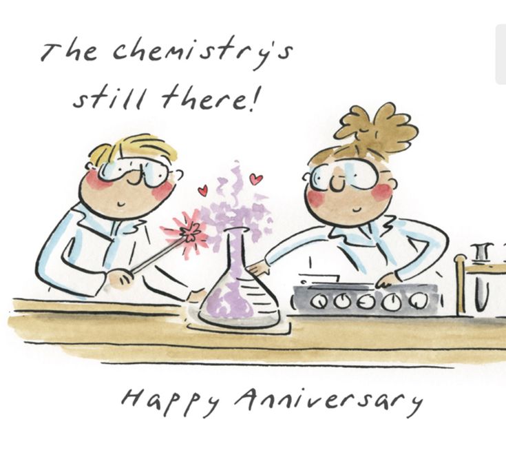 two people in lab coats are making an experiment