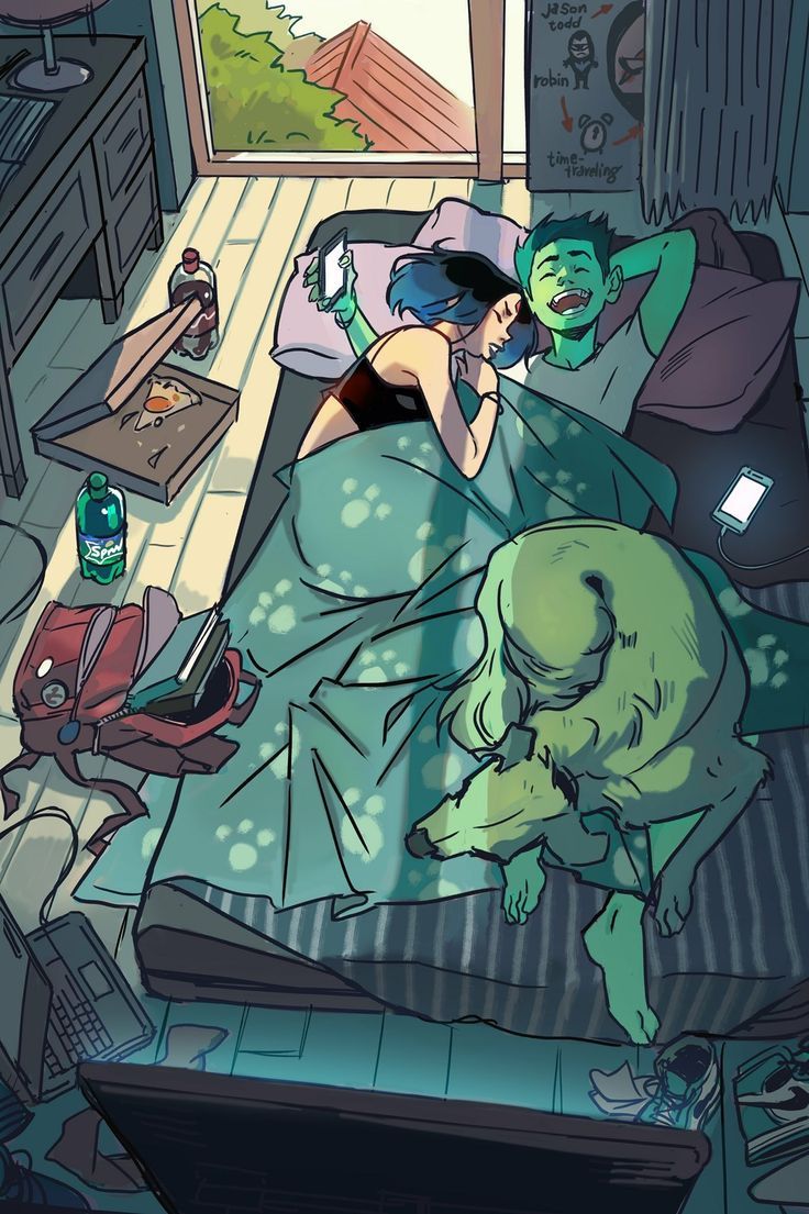 a woman laying in bed next to a green creature