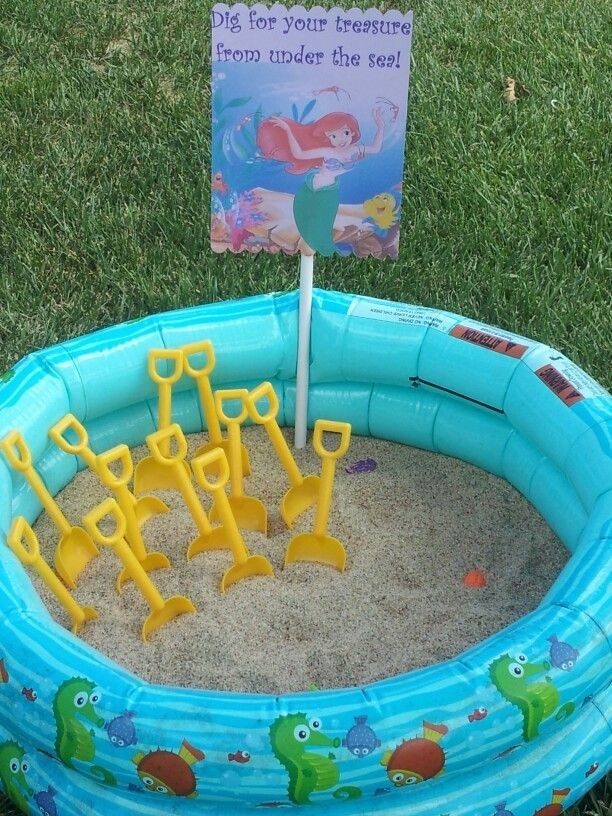 an inflatable kiddie pool with lots of sand