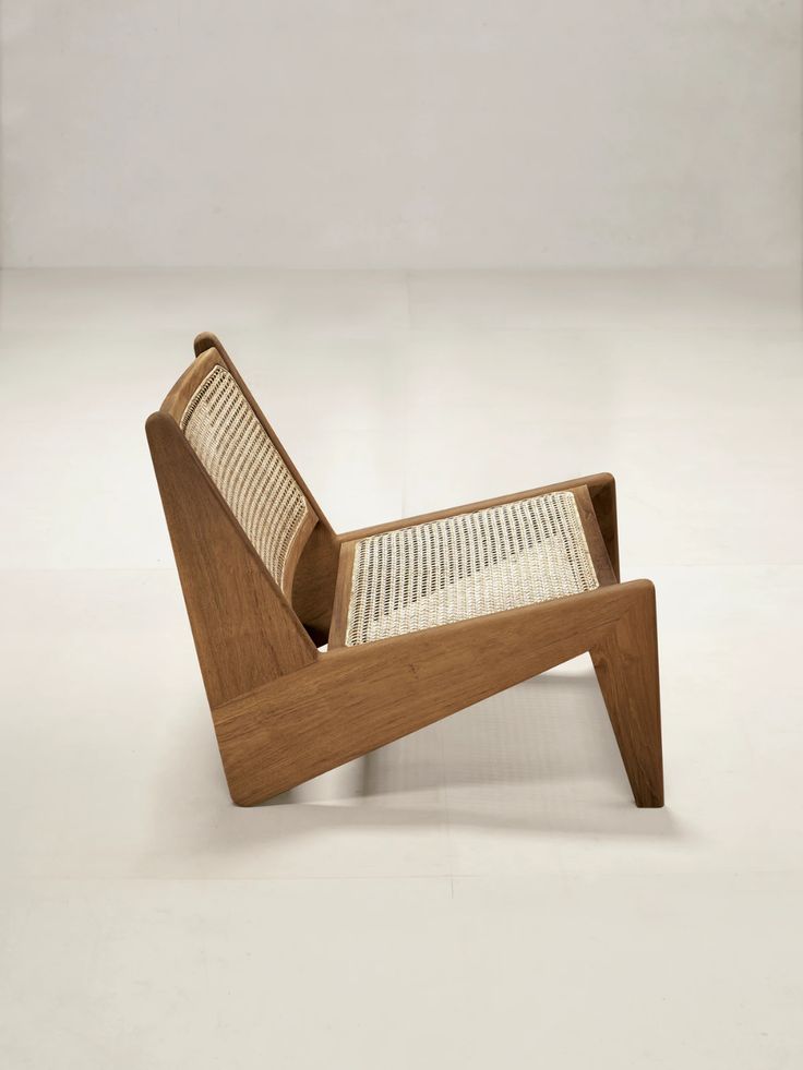 a chair made out of wood and woven material