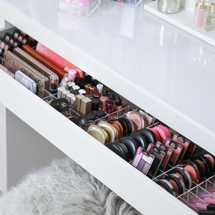 the drawers are filled with cosmetics and lipstick