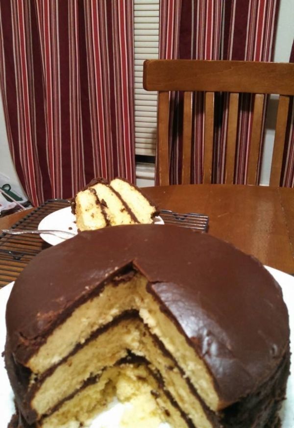 a chocolate cake cut in half on a plate