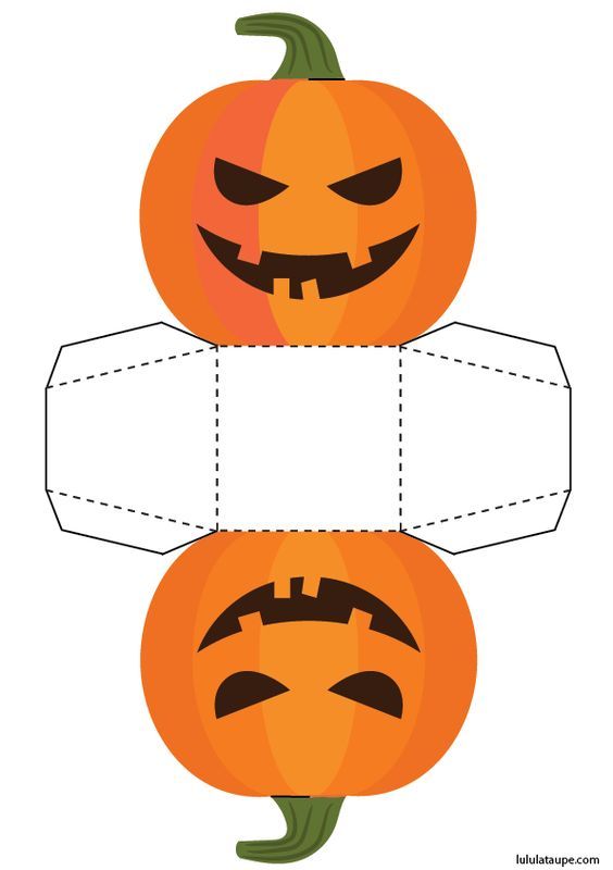 a paper pumpkin cut out to look like it has two faces