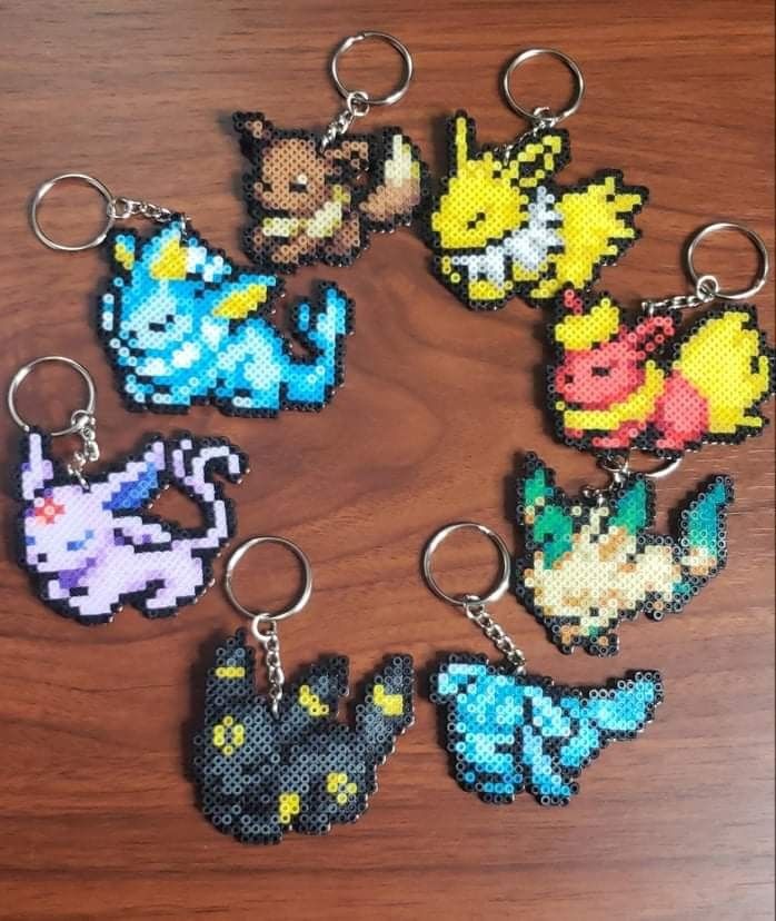 the pokemon keychains are made out of perler beads and have different designs on them