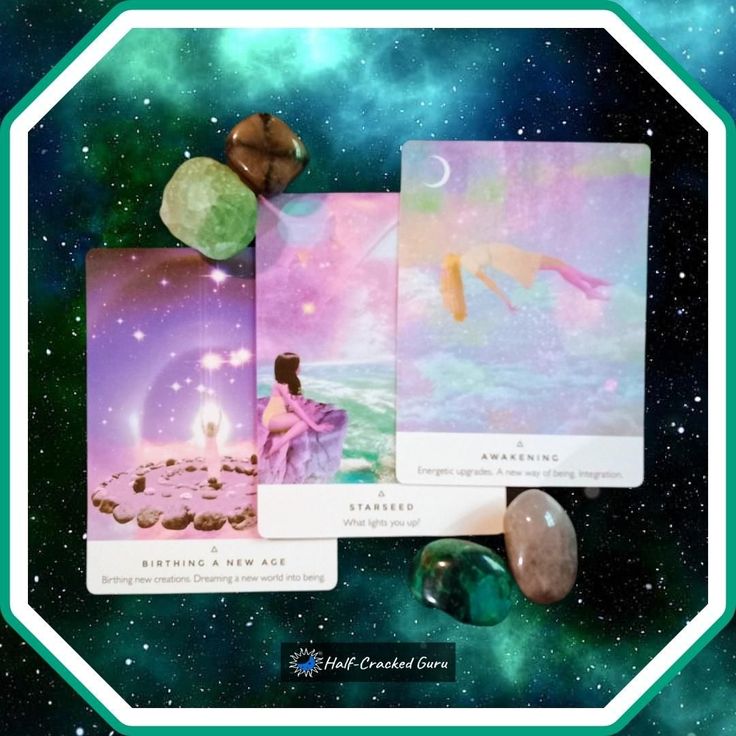 the tarot card deck is surrounded by crystals and other items in front of a galaxy background