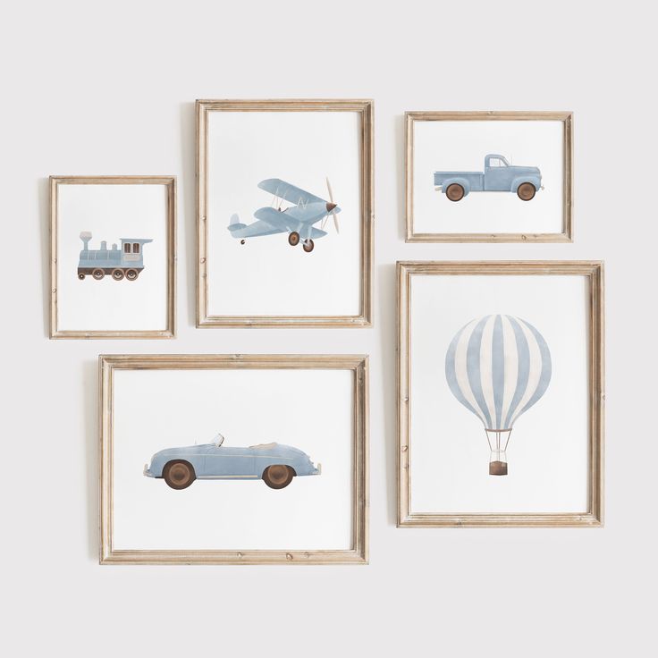 four framed pictures with cars and hot air balloons hanging on the wall in front of them