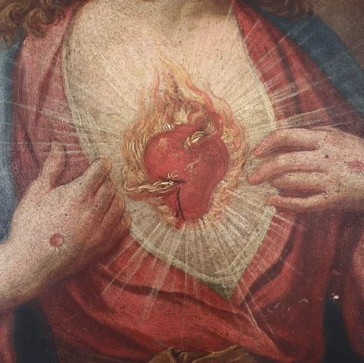 an image of the heart of jesus painted on a wall