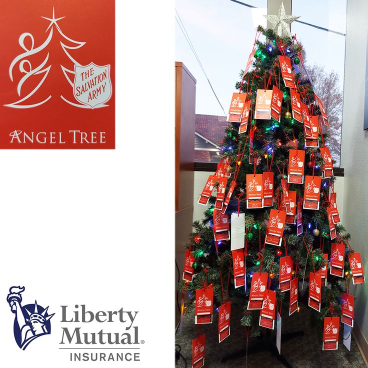 a christmas tree with red and green tags on it next to an angel tree sign