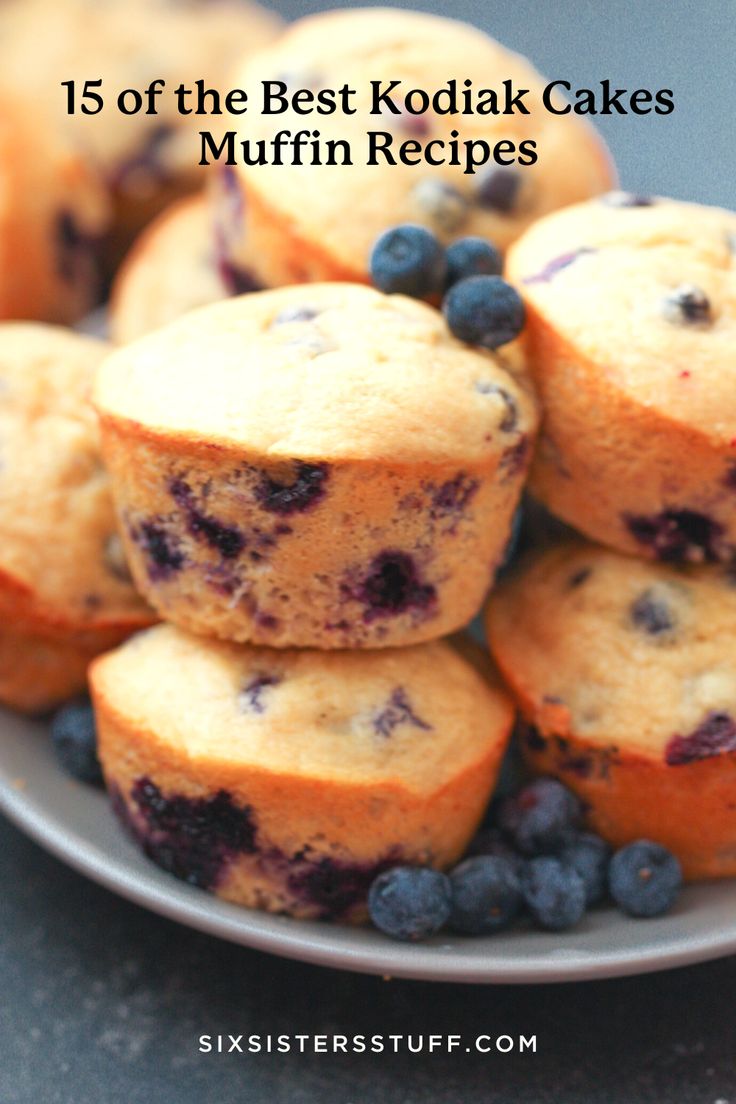 blueberry muffins stacked on top of each other in a plate with fresh blueberries