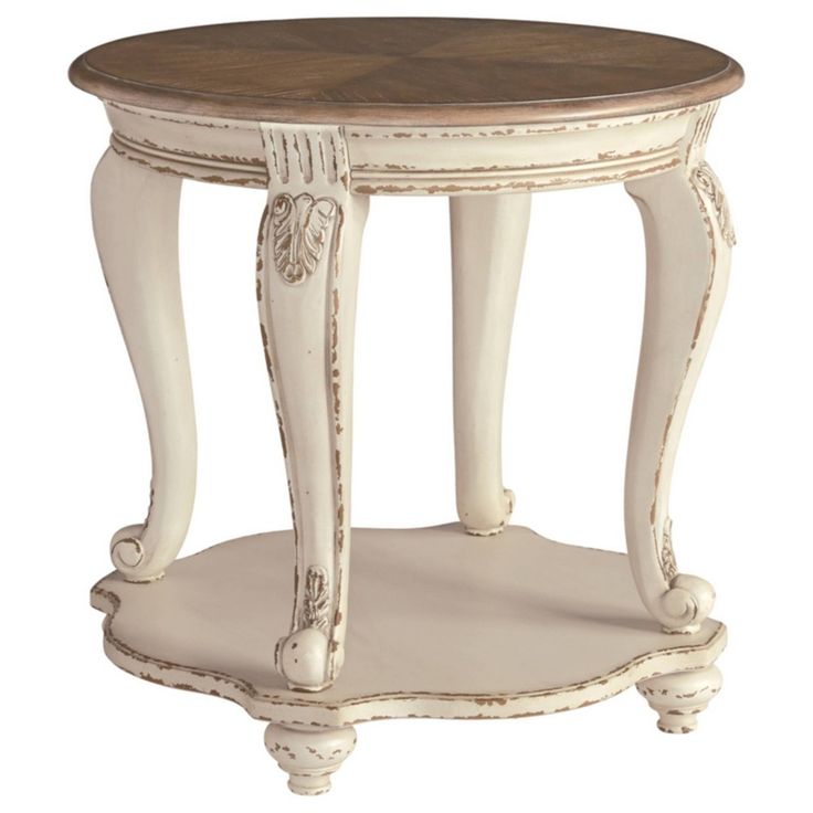 an old white table with a wooden top