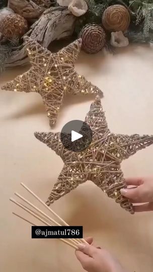 someone is decorating a star ornament with sticks