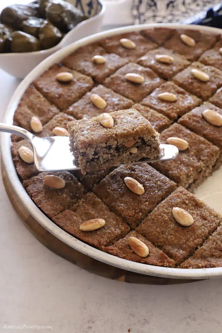 a plate with some brownies and nuts on it