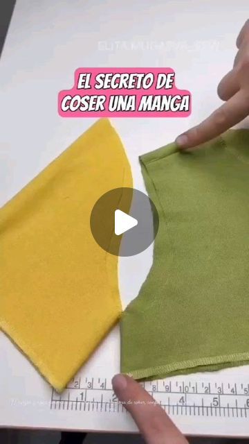 someone is cutting out the fabric on top of a piece of cloth to make a dress