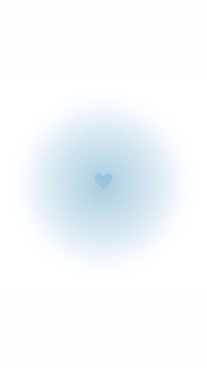 a blue circle with a heart in the middle on a white background that appears to be blurry