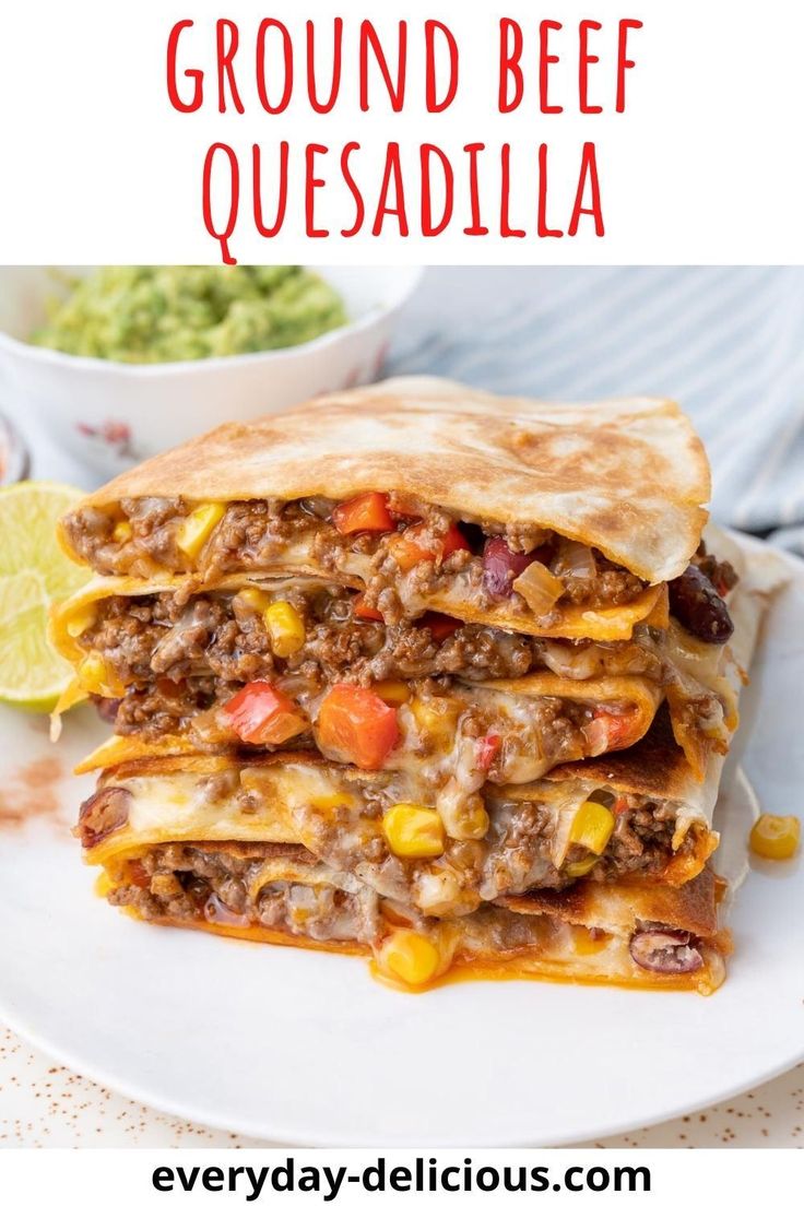 ground beef quesadilla on a plate with guacamole