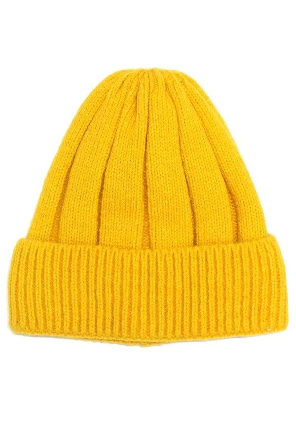 Solid color folded warm beanie. Made of 100% acrylic. Warm Solid Color Bonnet For Fall, Fall Acrylic Beanie Cap, Warm Solid Color Bonnet, One Size, Warm Solid Color One Size Bonnet, Acrylic Beanie For Cold Weather, Fall Beanie Bonnet In Acrylic, Acrylic Beanie Bonnet For Fall, Cold Weather Acrylic Yarn Beanie, Fall Acrylic Yarn Beanie Cap