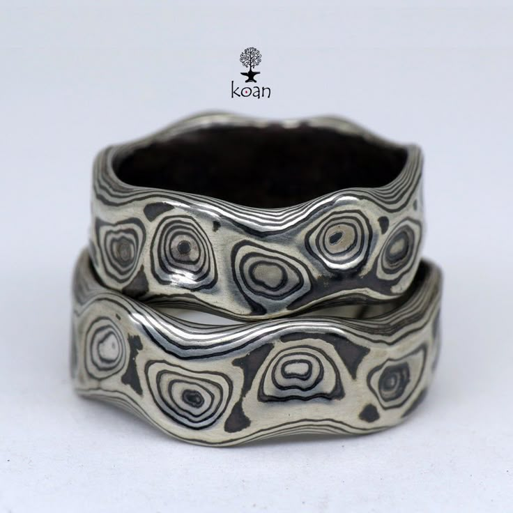 "These are unique mokume gane forged wedding or engagement rings, made of 14K white gold and sterling silver (oxidized). Can be ordered in pair as well as separatly up to your preferences in size, width, thikness and design. They are 100% handmade forged. The price will depend on final weight of the rings. Koan mokume gane jewellery My name is Andrew Seginovich, designer, maker and creator of Koan Mokume gane Jewelry. Welcome to my shop! The studio was created in 2005, and since that time I've b Silver Patina Jewelry For Weddings, Mode Hippie, Rings Etsy, Mokume Gane, בר מצווה, Dope Jewelry, Textured Ring, Funky Jewelry, Jewelry Lookbook