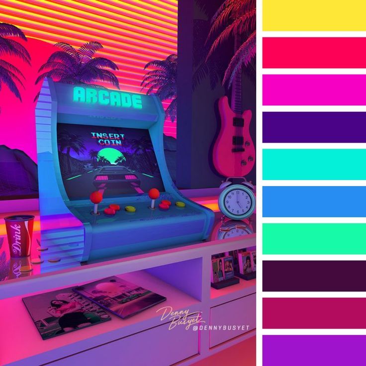 an arcade machine sitting on top of a table next to a wall with neon colors