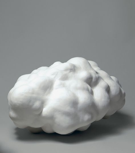 a white cloud sculpture sitting on top of a table