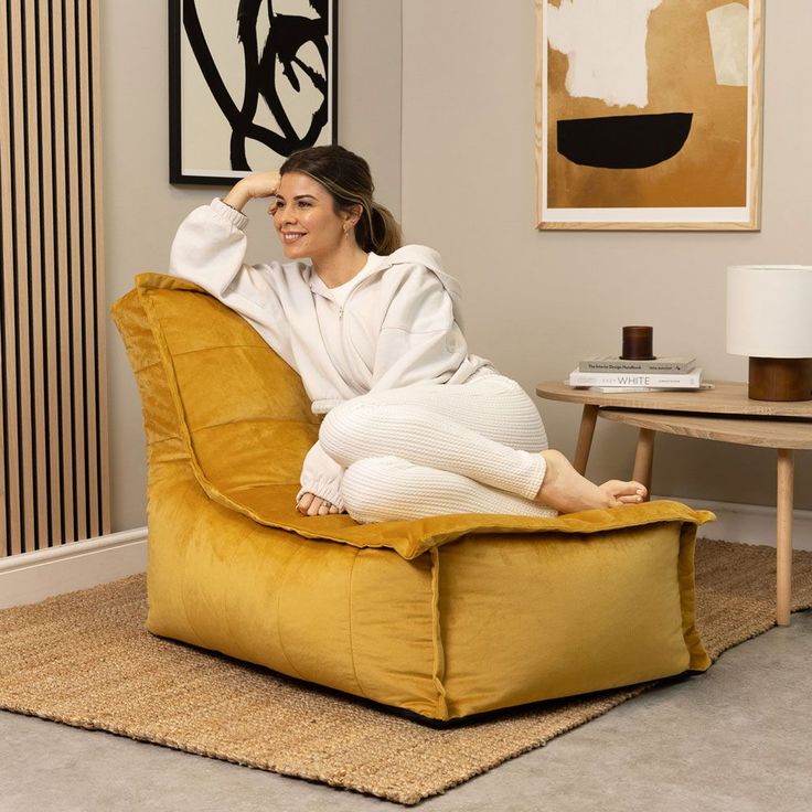 a woman sitting on a chair in a living room