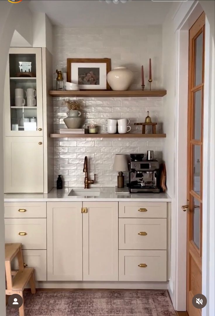 the kitchen is clean and ready to be used for cooking or baking, while also being used as a coffee bar