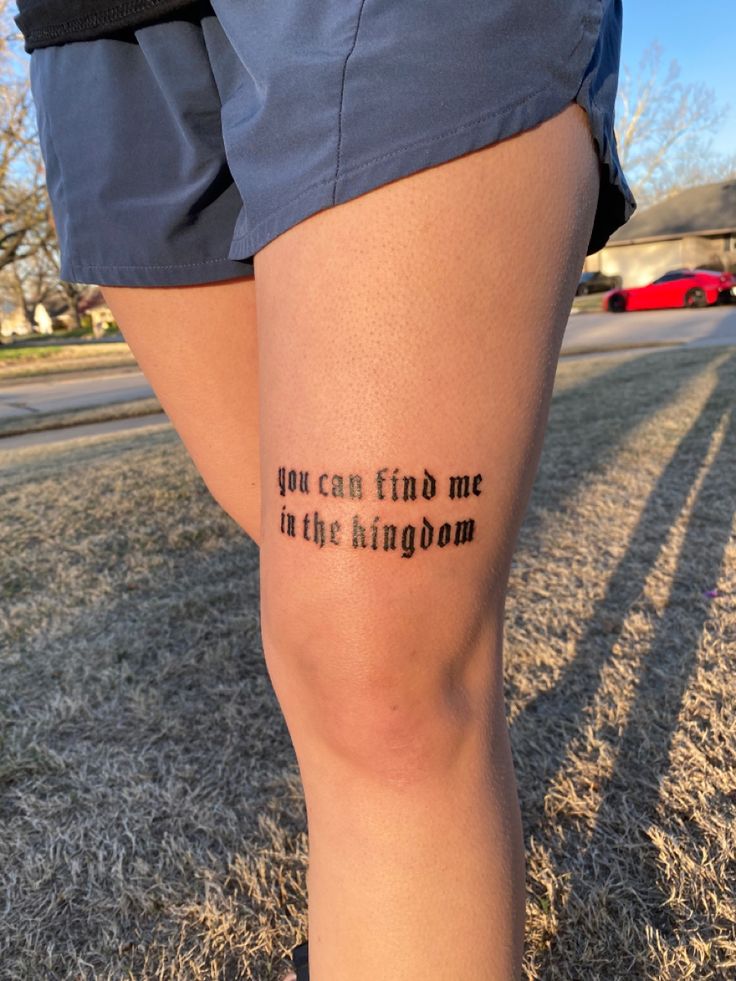 a woman's leg with the words you can find me in the kingdom written on it