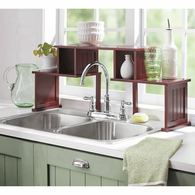 the kitchen sink is clean and ready to be used as a storage unit for dishes