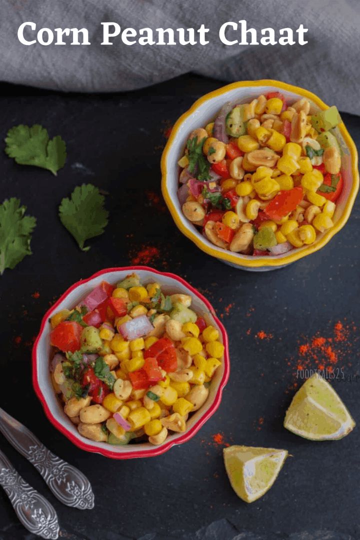 two bowls filled with corn and cilantro on top of a black surface next to lime wedges