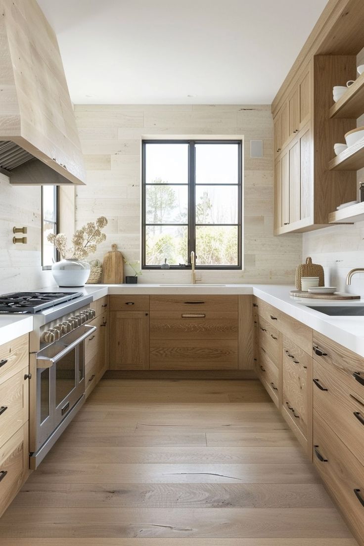 a kitchen with wooden cabinets and white counter tops, along with a window that looks out onto the outdoors