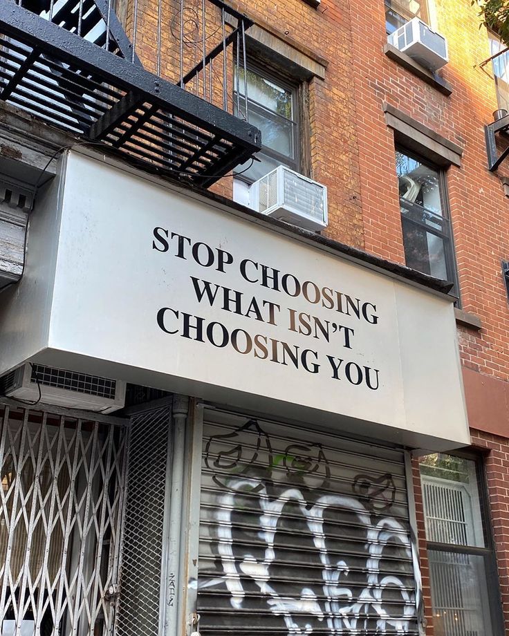 graffiti on the side of a building that says stop choosing what isn't choosing you