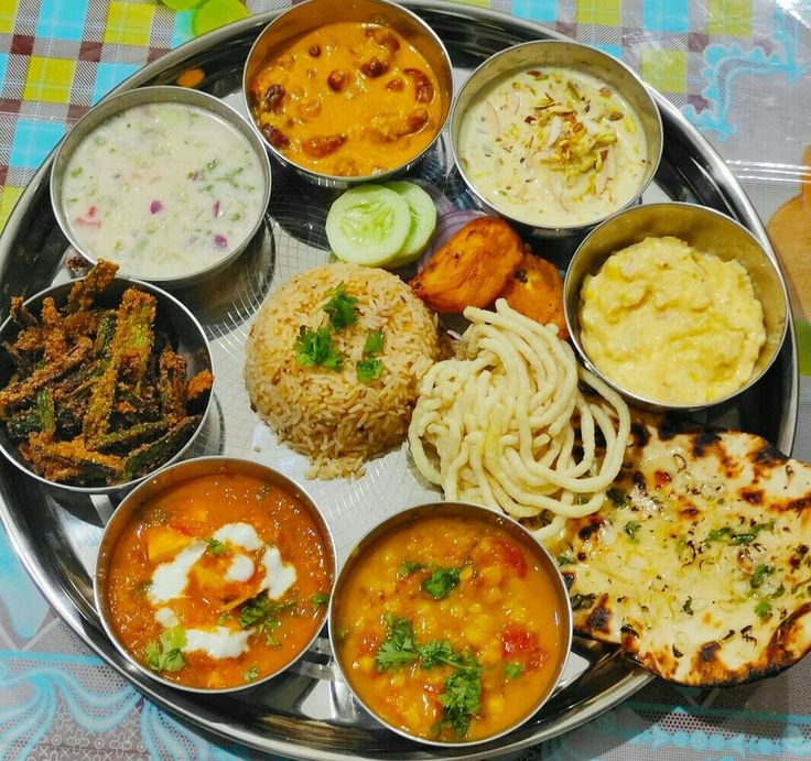 a metal plate topped with different types of food