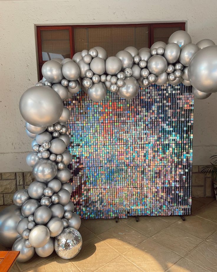 an art installation made out of silver balls