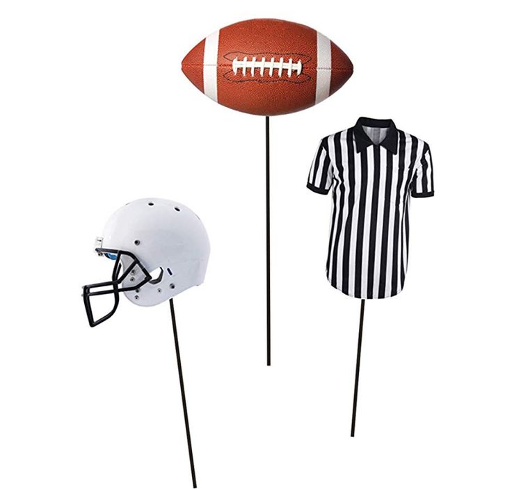 two footballs and a referee's jersey on sticks, one is black and white