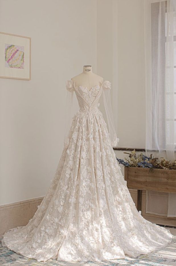 a wedding dress on display in a room